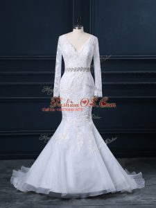 Lovely White Organza Backless Wedding Gown Long Sleeves Brush Train Beading and Lace