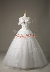 Stunning White Wedding Dress Beach with Beading and Appliques V-neck Short Sleeves Lace Up