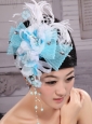 Feather and Rhinestones Decorate Aqua Blue Headpieces